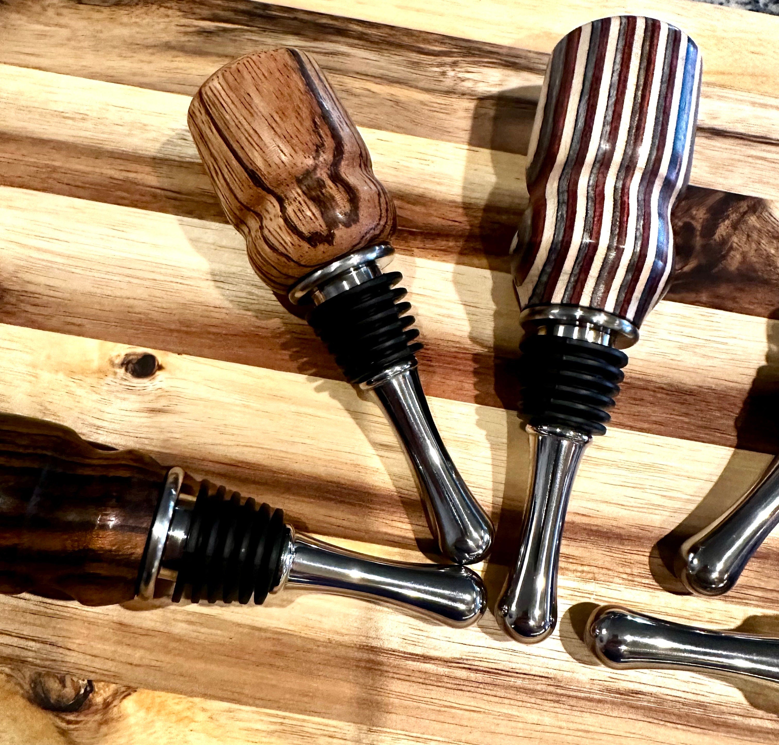 handmade wooden wine bottle stoppers hand turned from hard wood with stainless steel