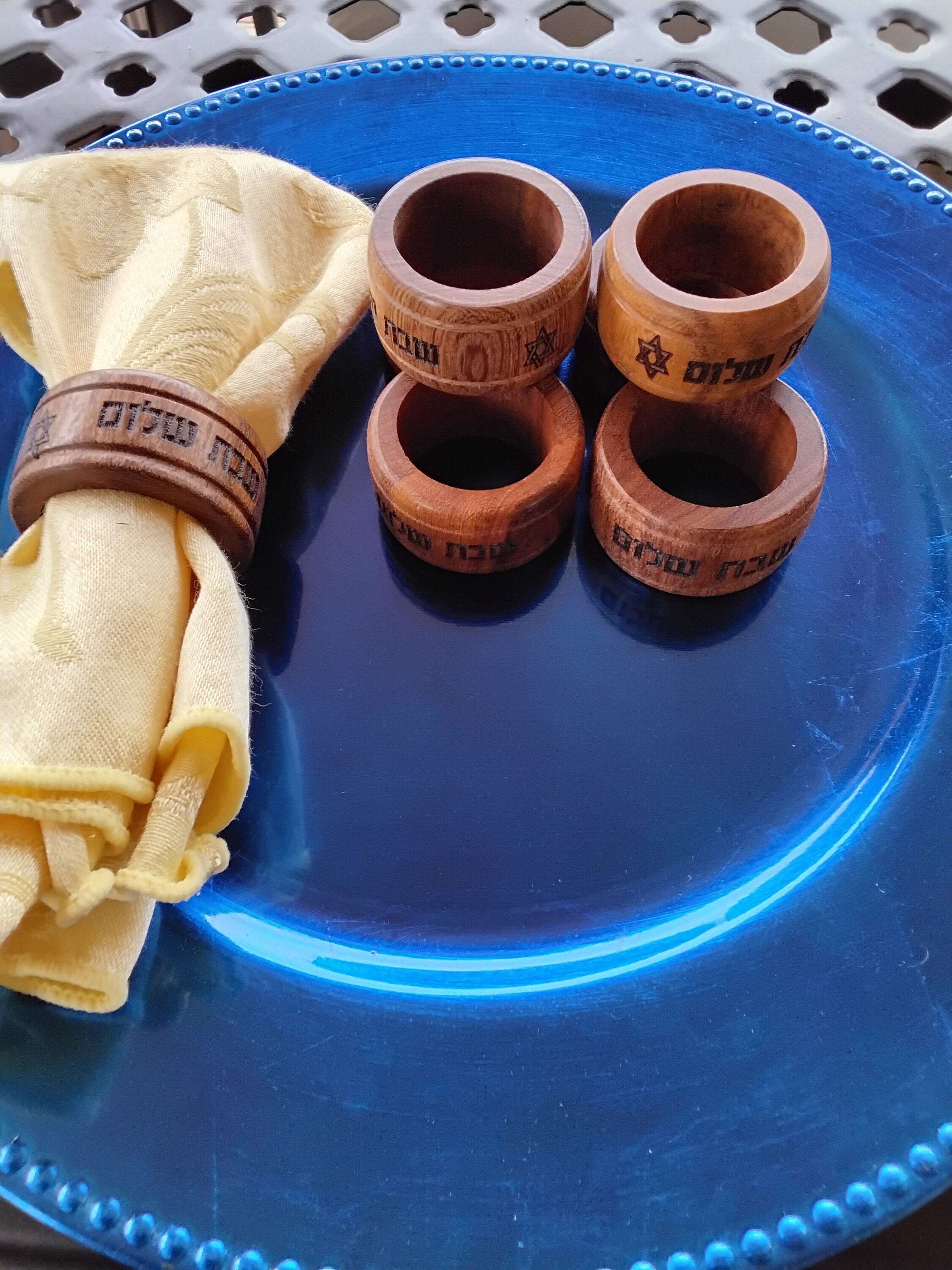 Wooden napkin rings set with Hebrew Shabbat Shalom dinner celebration with the star of David engraved on the wood rings, set of 4 rings.