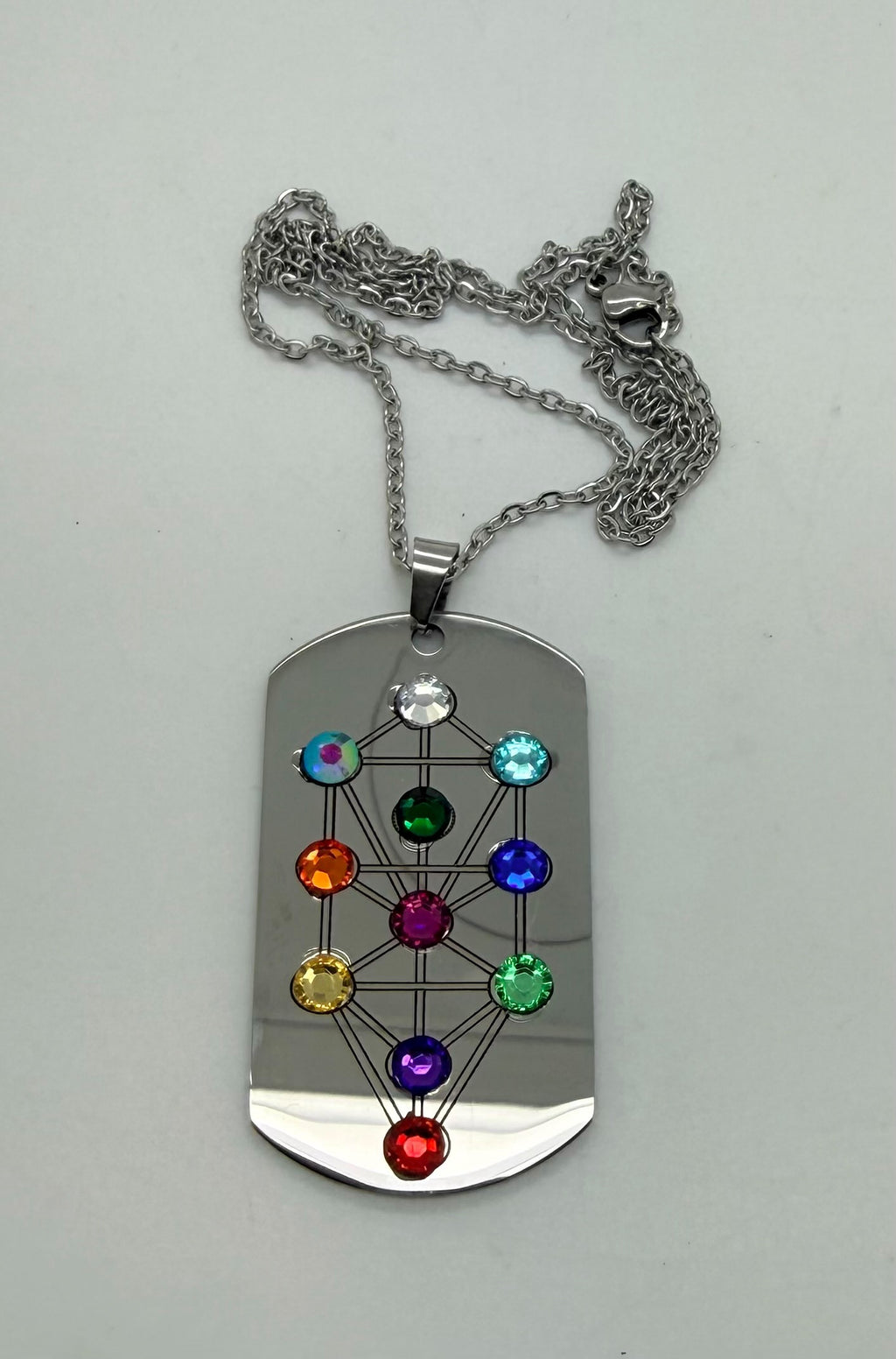 Holy Land Mall stainless steel dog tag pendant featuring an etched Tree of Life motif with colorful chakra crystals.